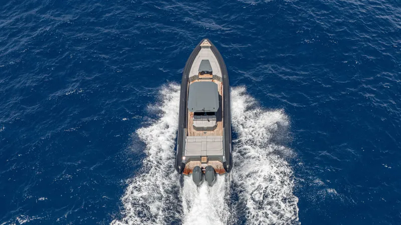 Slide: The Image of Aerial view of 2025 Skipper-BSK 38 boat cruising on open blue sea. - 20