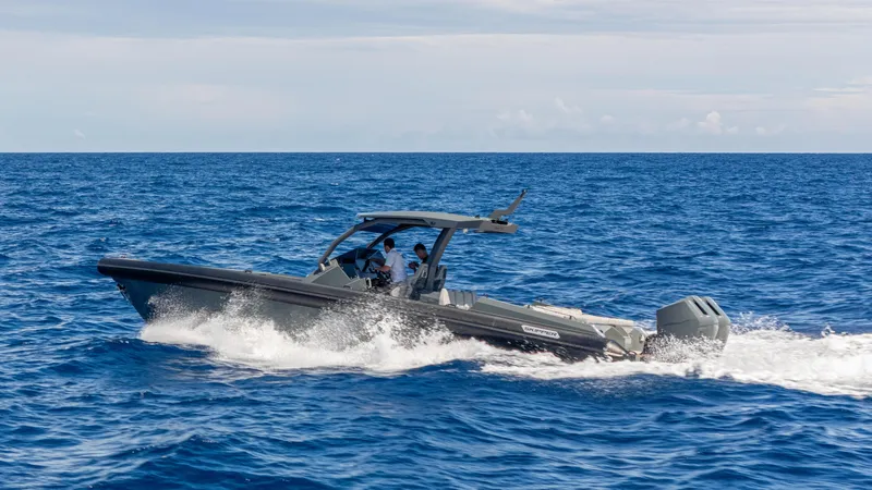 Slide: The Image of 2025 Skipper-BSK 38 boat cruising on open sea under clear sky. - 22