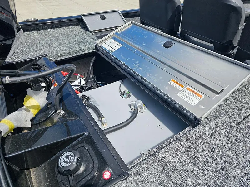 Slide: The Image of 2026 Tracker Pro Team 175 Crappie Edition boat interior with open storage compartment. - 13