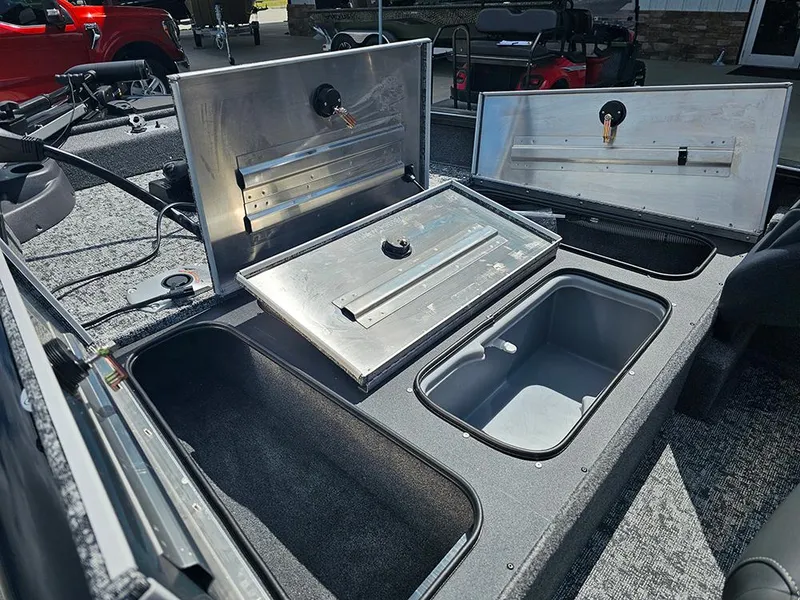 Slide: The Image of 2026 Tracker Pro Team 175 Crappie Edition boat with open storage compartments. - 18