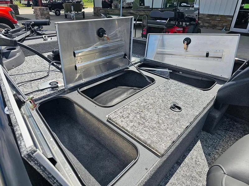 Slide: The Image of 2026 Tracker Pro Team 175 Crappie Edition boat with open storage compartments. - 19