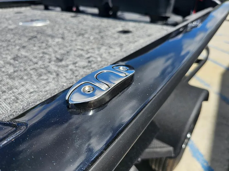 Slide: The Image of Close-up of 2026 Tracker Pro Team 175 Crappie Edition boat detail, featuring sleek metal hardware. - 21