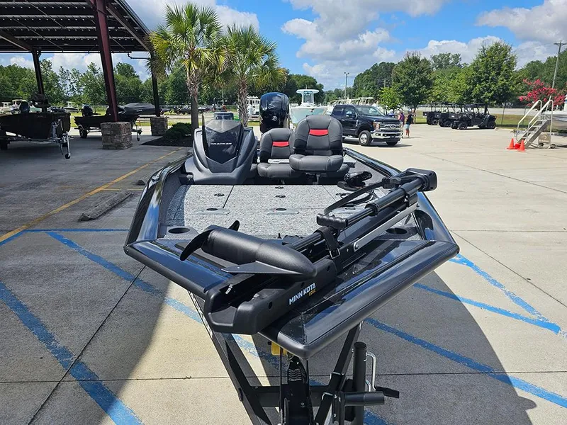 Slide: The Image of 2026 Tracker Pro Team 175 Crappie Edition boat in outdoor showroom setting. - 4