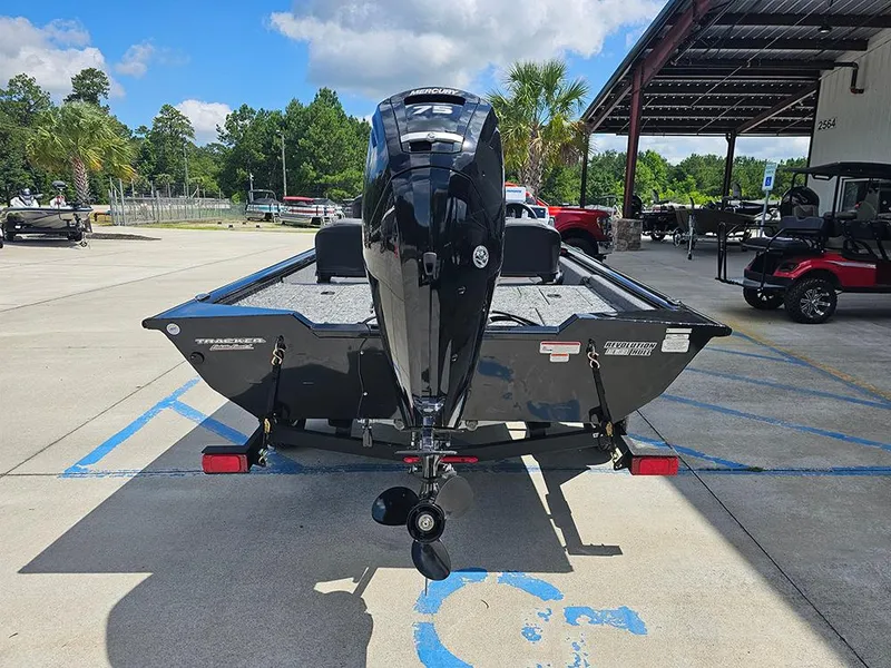 Slide: The Image of 2026 Tracker Pro Team 175 Crappie Edition boat with Mercury engine, parked outdoors. - 8