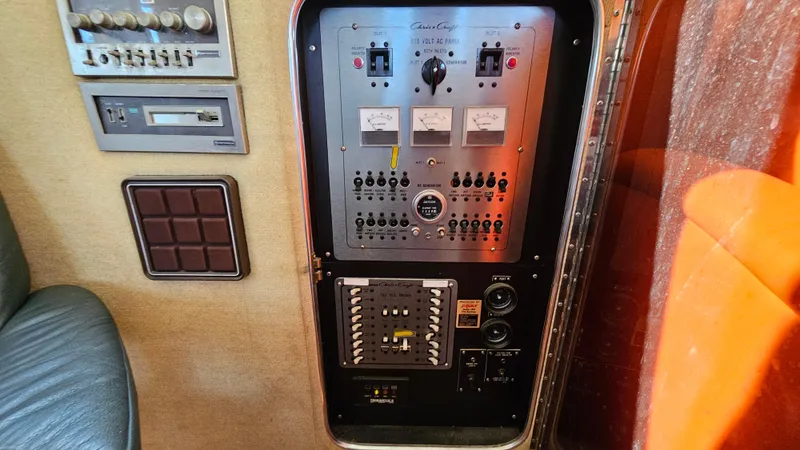 Slide: The Image of Electrical control panel inside a 1983 Chris-Craft 381 Catalina boat. - 28
