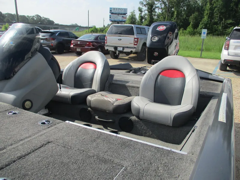 Slide: The Image of 2014 Bass Tracker PRO TEAM 190 boat interior with gray and red seating. - 6