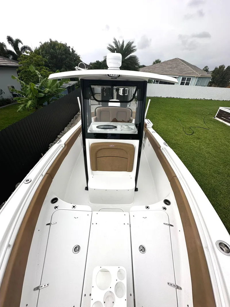 Slide: The Image of 2022 Sea Hunt Ultra 255 SE boat with spacious deck and modern design. - 26