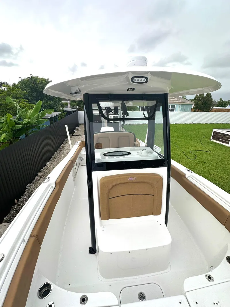 Slide: The Image of 2022 Sea Hunt Ultra 255 SE boat with sleek design and spacious seating. - 27