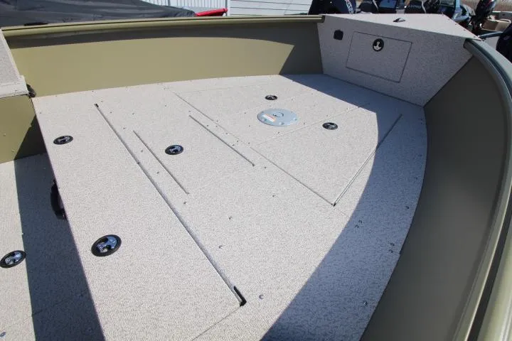 Slide: The Image of 2025 Lund 2075 Alaskan Tiller boat interior with spacious deck and storage compartments. - 3