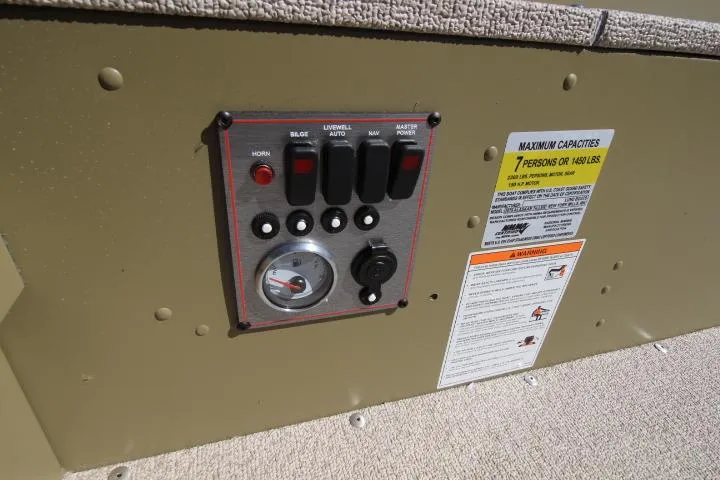 Slide: The Image of Control panel of 2025 Lund 2075 Alaskan Tiller boat with capacity warning label. - 5