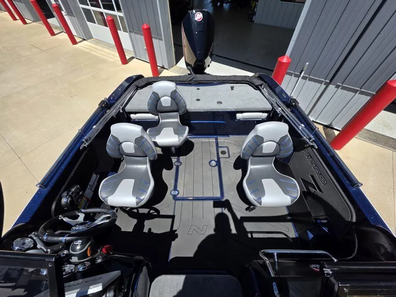 Slide: The Image of 2025 Nitro ZV19 Sport Pro boat interior with four seats and steering wheel. - 11