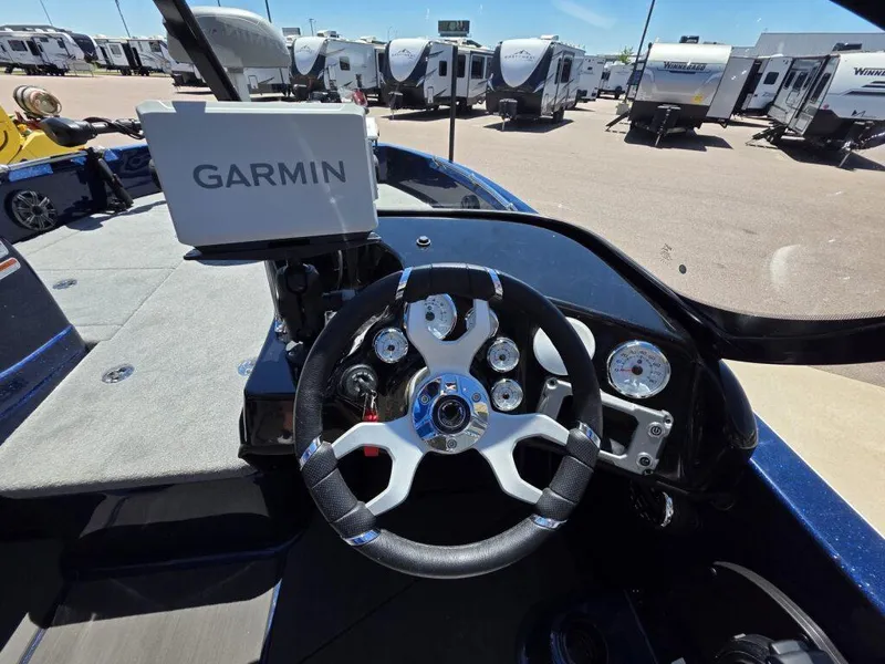 Slide: The Image of Steering wheel and Garmin display in 2025 Nitro ZV19 Sport Pro boat cockpit. - 13