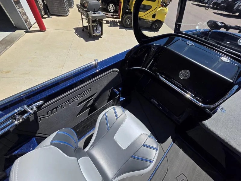 Slide: The Image of Interior of 2025 Nitro ZV19 Sport Pro boat with sleek seating and dashboard. - 15