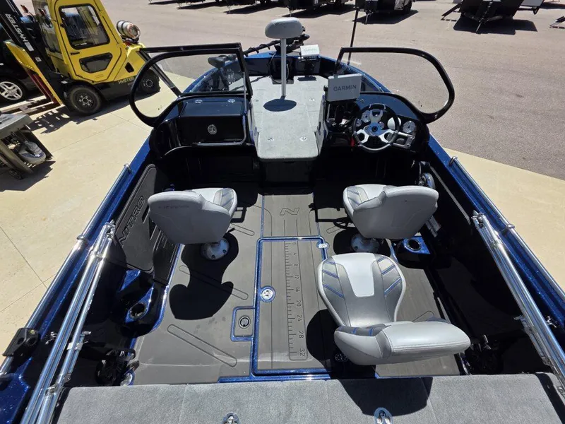 Slide: The Image of 2025 Nitro ZV19 Sport Pro boat interior with seating and steering console. - 16