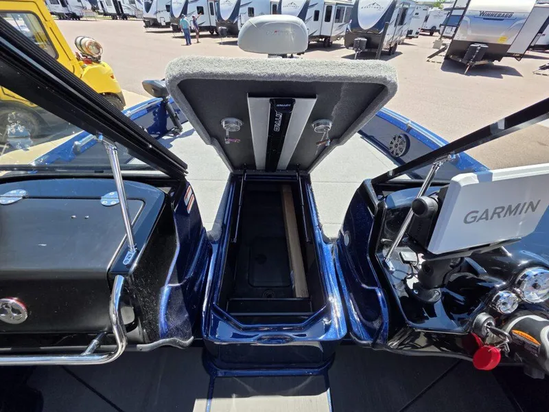 Slide: The Image of 2025 Nitro ZV19 Sport Pro boat interior with Garmin system and storage compartment. - 18