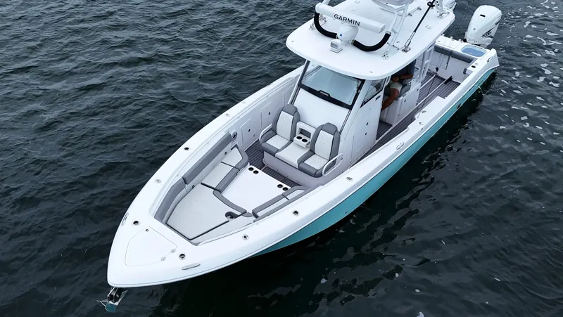 Slide: The Image of 2023 Everglades 365 CC boat on water, aerial view. - 12