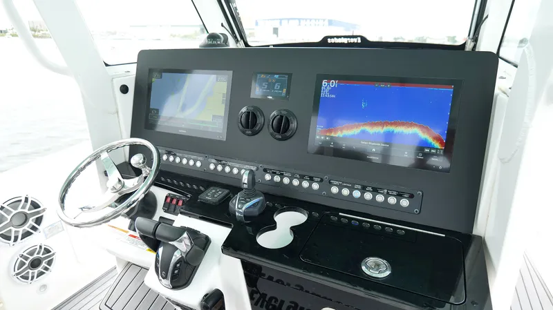 Slide: The Image of Control panel of 2023 Everglades 365 CC boat with advanced navigation displays. - 15