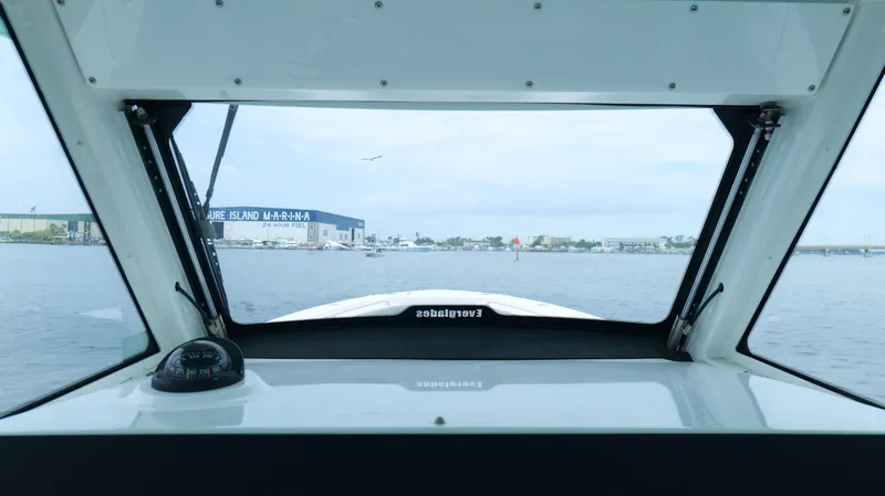 Slide: The Image of View from 2023 Everglades 365 CC boat cockpit, overlooking marina and waterway. - 17