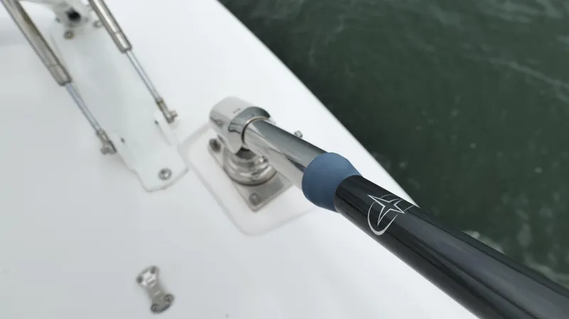 Slide: The Image of Close-up of a 2023 Everglades 365 CC boat's stainless steel railing and fittings. - 24