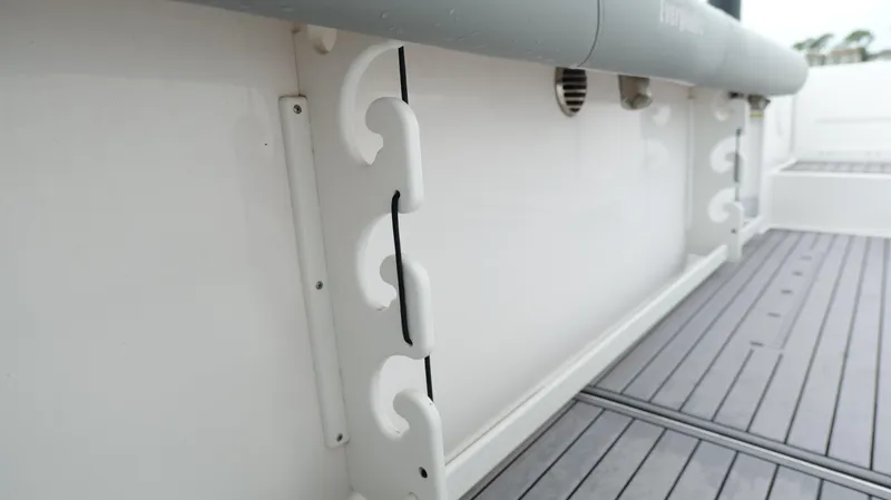 Slide: The Image of 2023 Everglades 365 CC boat interior with rod holders and non-slip deck. - 39
