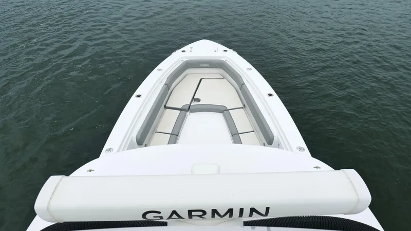 Slide: The Image of 2023 Everglades 365 CC boat bow with seating, on calm water. - 40