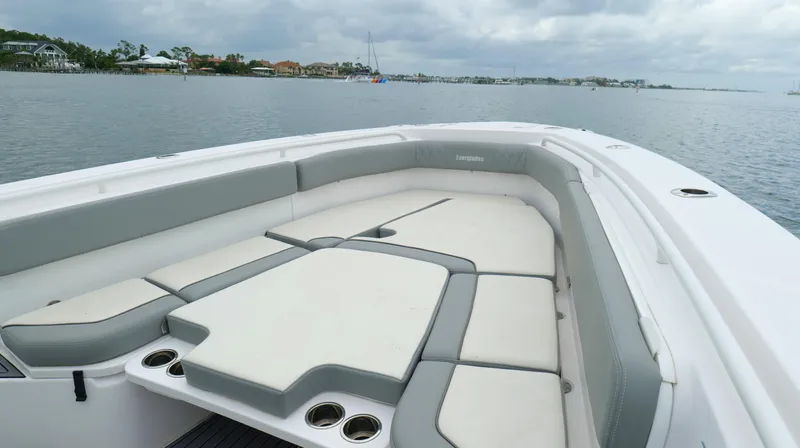 Slide: The Image of 2023 Everglades 365 CC boat with spacious seating on calm water. - 44