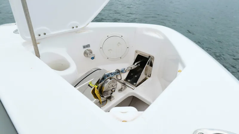 Slide: The Image of Anchor compartment of 2023 Everglades 365 CC boat with raw water access. - 45