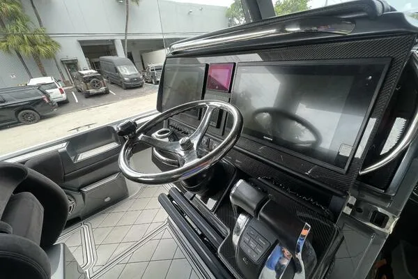 Slide: The Image of 2019 Nor-Tech 450 Sport Center Console dashboard with steering wheel and digital displays. - 13