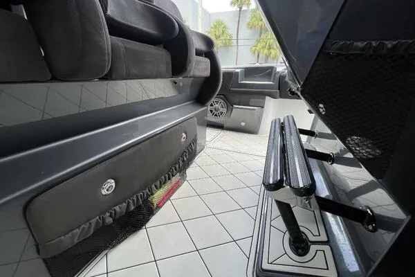 Slide: The Image of 2019 Nor-Tech 450 Sport Center Console interior with seating and step ladder, featuring sleek design. - 14