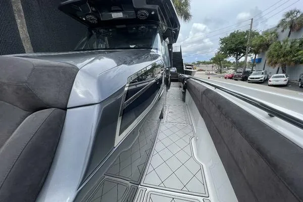 Slide: The Image of 2019 Nor-Tech 450 Sport Center Console boat with sleek design and spacious deck. - 16