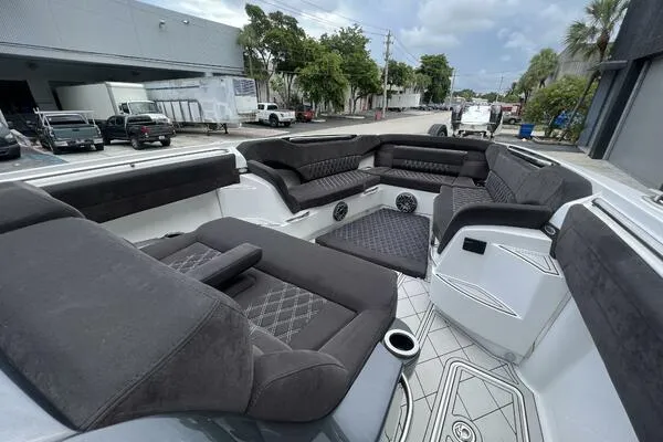 Slide: The Image of 2019 Nor-Tech 450 Sport Center Console with luxurious seating and modern design. - 17