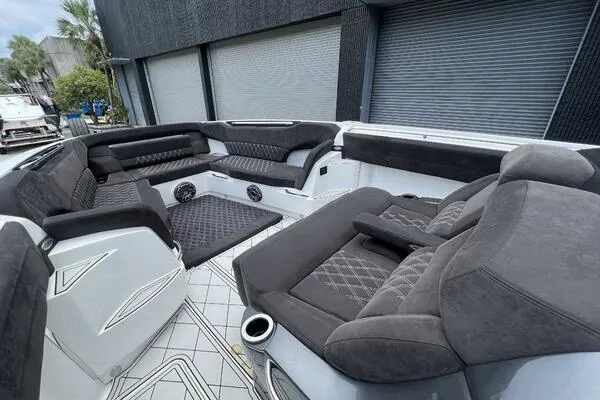 Slide: The Image of 2019 Nor-Tech 450 Sport Center Console with luxurious seating and modern design. - 19