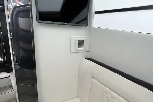 Slide: The Image of Interior of 2019 Nor-Tech 450 Sport Center Console with TV and seating. - 22