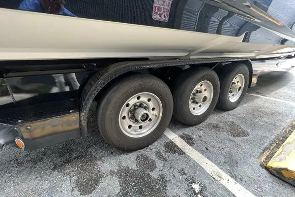 Slide: The Image of Trailer with triple axles for 2019 Nor-Tech 450 Sport Center Console boat. - 26