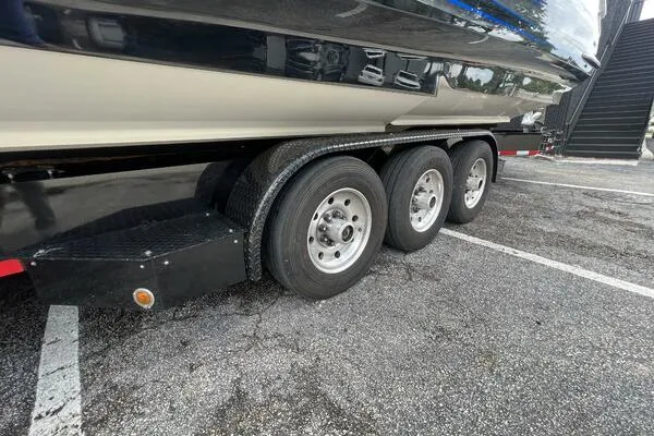 Slide: The Image of Trailer for 2019 Nor-Tech 450 Sport Center Console boat with triple axles. - 28