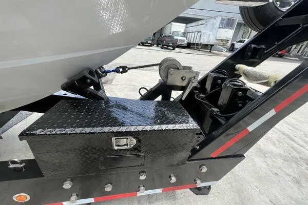 Slide: The Image of 2019 Nor-Tech 450 Sport Center Console on trailer with toolbox and winch. - 29