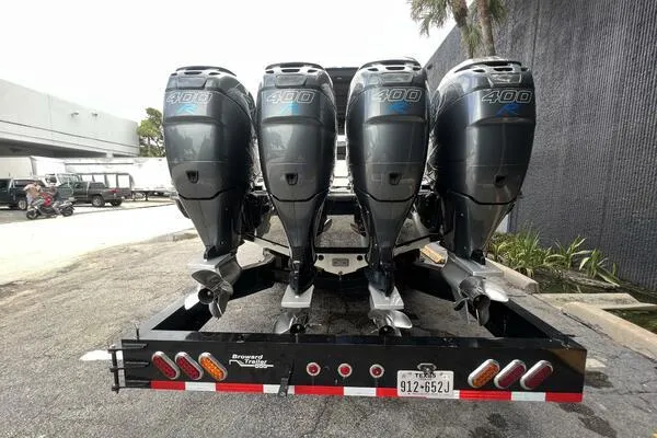 Slide: The Image of 2019 Nor-Tech 450 Sport Center Console with four 400 horsepower engines on a trailer. - 6