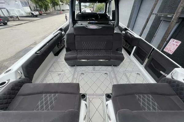 Slide: The Image of 2019 Nor-Tech 450 Sport Center Console interior with luxurious seating and spacious deck. - 8