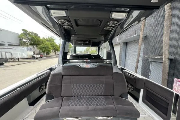 Slide: The Image of 2019 Nor-Tech 450 Sport Center Console interior with luxurious seating and modern design. - 9