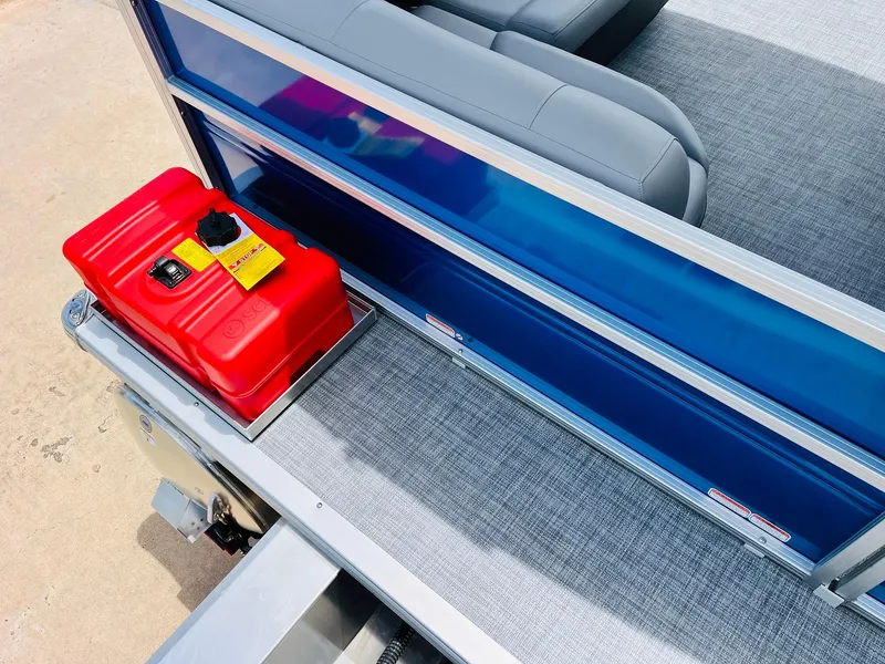 Slide: The Image of 2026 Sun Tracker Party Barge 16 DLX with red fuel tank and gray seating. - 12