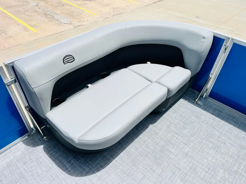 Slide: The Image of 2026 Sun Tracker Party Barge 16 DLX, featuring sleek gray seating and modern design. - 16