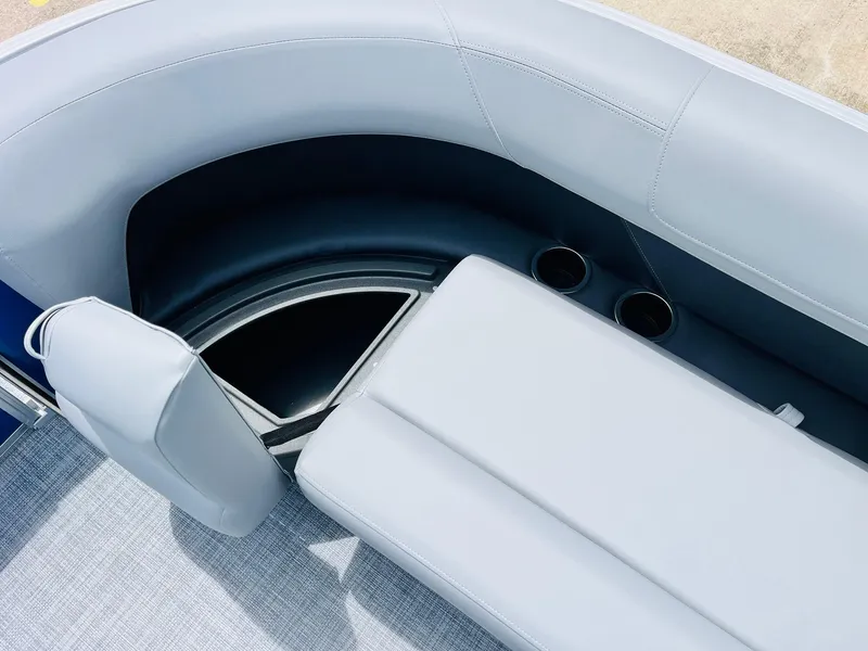 Slide: The Image of 2026 Sun Tracker Party Barge 16 DLX interior seating with cup holders. - 24