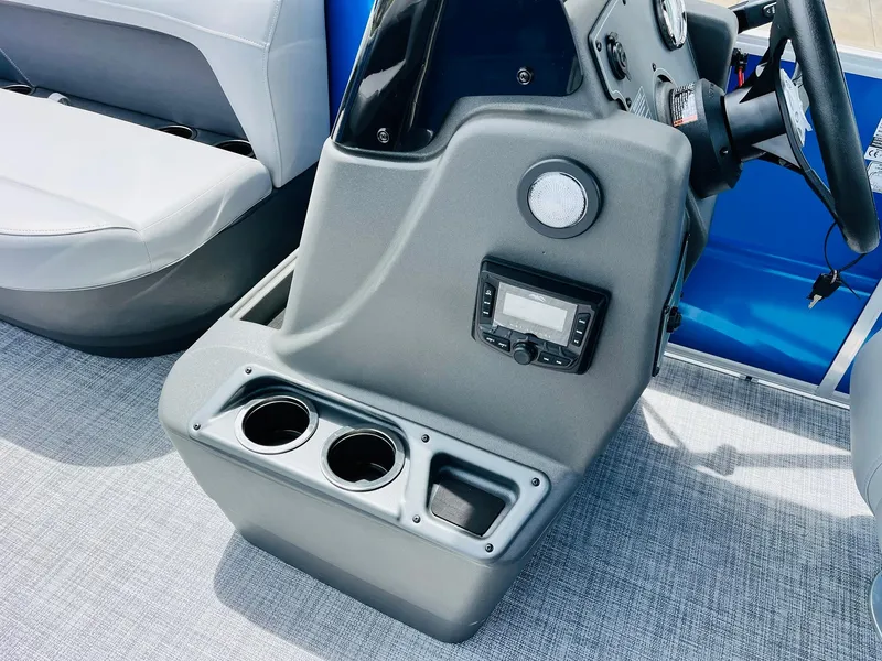 Slide: The Image of Interior of 2026 Sun Tracker Party Barge 16 DLX with console and cup holders. - 35