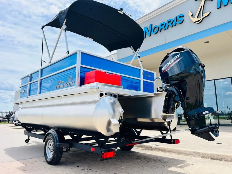 Slide: The Image of 2026 Sun Tracker Party Barge 16 DLX pontoon boat with Mercury engine at dealership. - 8