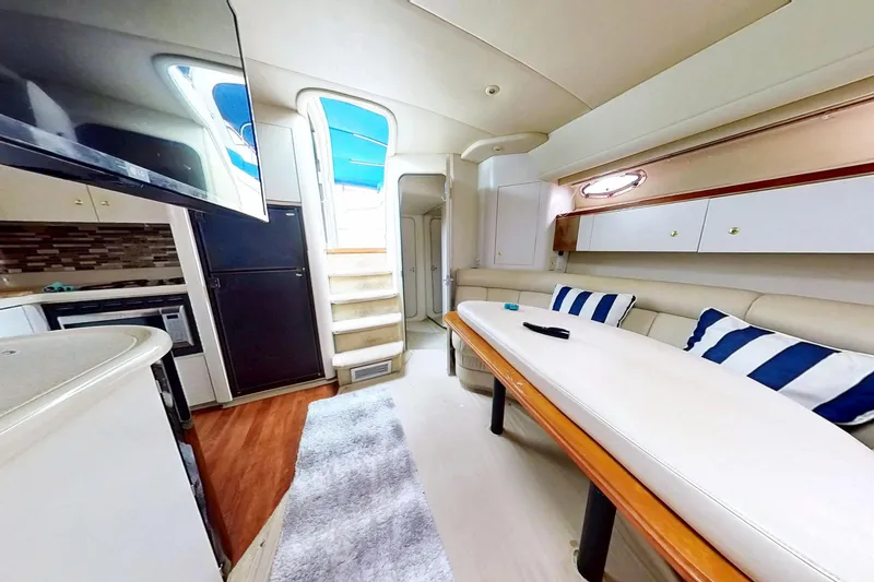 Slide: The Image of Luxurious interior of 1998 Cruisers Yachts 4270 Express with modern amenities and stylish decor. - 10