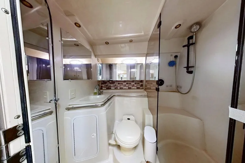 Slide: The Image of Bathroom interior of 1998 Cruisers Yachts 4270 Express with shower and modern fixtures. - 20