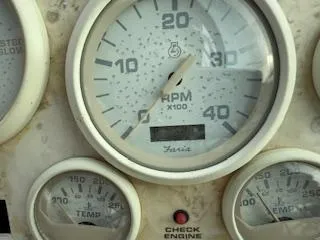 Slide: The Image of Close-up of 1998 Cruisers Yachts 4270 Express dashboard gauges, showing RPM and engine indicators. - 31
