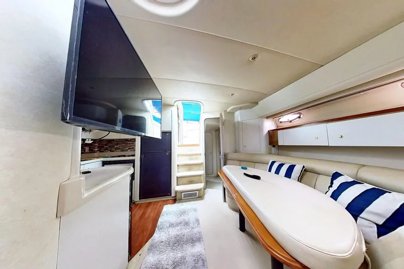 Slide: The Image of Luxurious interior of 1998 Cruisers Yachts 4270 Express with modern amenities and stylish decor. - 4