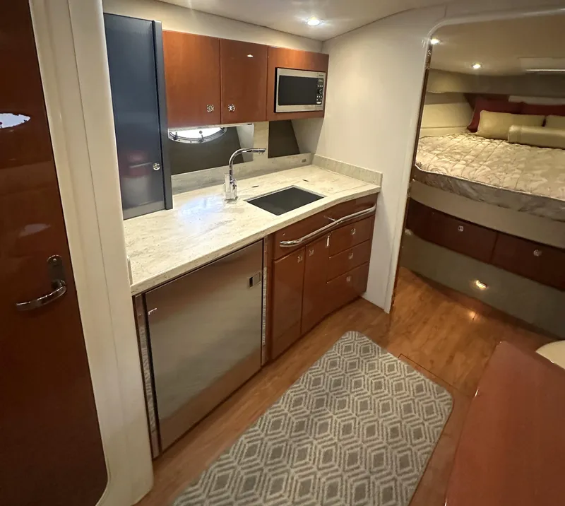 Slide: The Image of Interior of 2013 Formula 37 PC yacht with modern kitchen and cozy bedroom. - 10