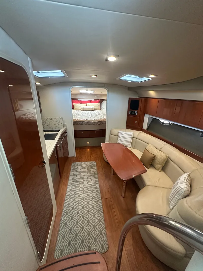 Slide: The Image of Luxurious interior of 2013 Formula 37 PC yacht with cozy seating and elegant wood finishes. - 13
